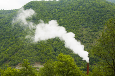 Smoke emitting from volcanic mountain