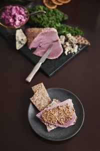 Christmas ham on cutting board and plate