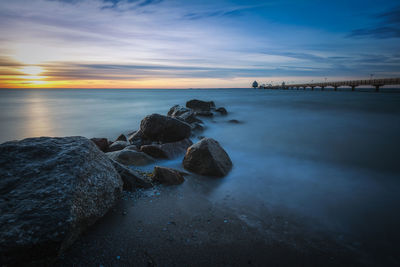 Scenic view of sea against sky during sunset