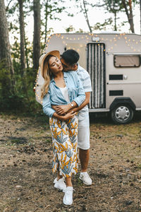 Married asian couple in love travel by camper car on a road trip in nature on their honeymoon