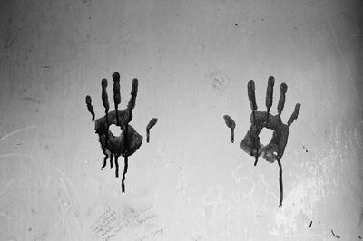 Hand prints on wall