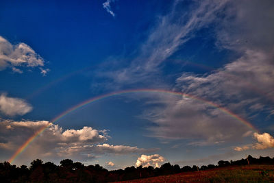 Low angle view of rainbow against sky