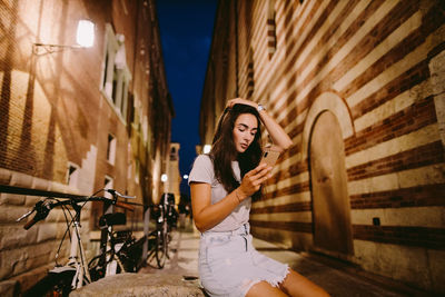 Woman standing in a city