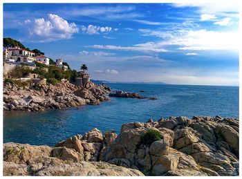 Scenic view of sea against cloudy sky