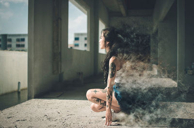 Side view of woman in a building