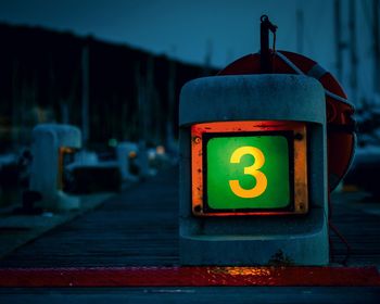 Jetty number 3 at marina di punta ala at dusk - neon sign