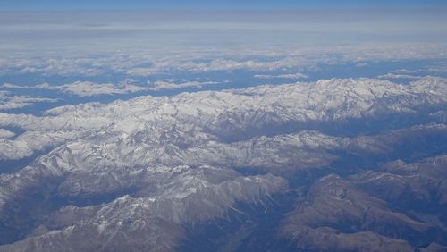 Aerial view of mountain range against sky