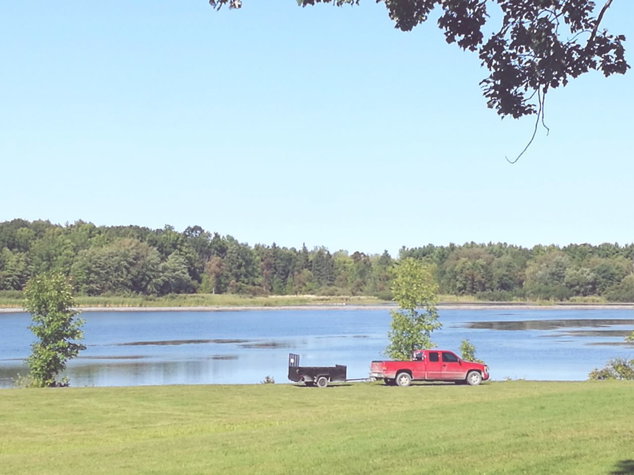 BOAT ON LAKE AGAINST CLEAR SKY