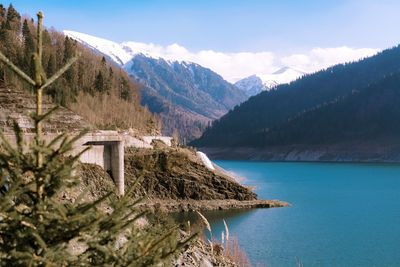 Scenic view of lake and mountains against sky