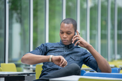 Man sitting on mobile phone