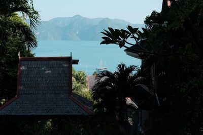 Scenic view of lake and mountains against clear sky