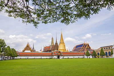 View of temple building against cloudy sky