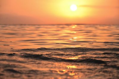 Scenic view of sea against romantic sky at sunset