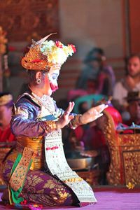 Woman in traditional clothing dancing