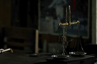 Close-up of weight scale on table in courtroom