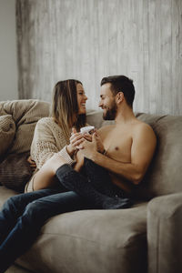 Young couple sitting on sofa