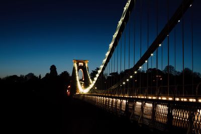 Illuminated suspension bridge at night