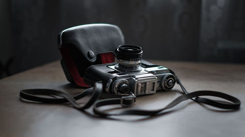 Close-up of vintage camera on table