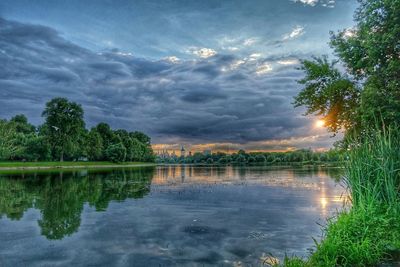 Scenic view of lake against cloudy sky