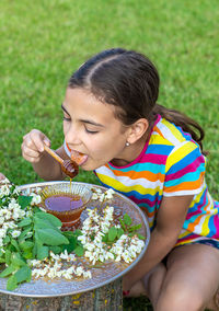 Cute girl blowing bubbles at park