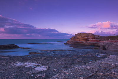 Scenic view of sea against cloudy sky