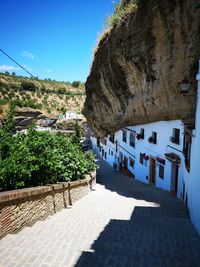 Panoramic view of buildings and mountain against sky