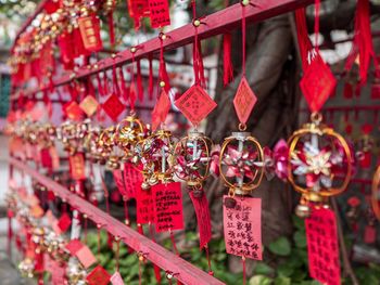 Close-up of decoration hanging from railing