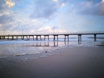 Pier over sea against sky