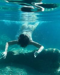 Man swimming in pool