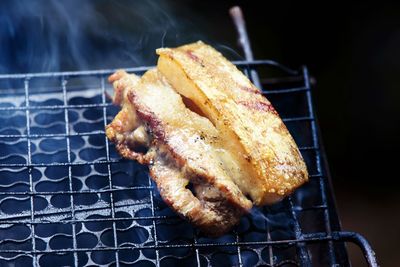 Close-up of meat on barbecue grill