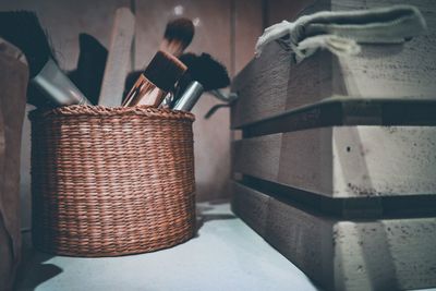 Close-up of wicker basket on table at home