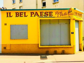 Yellow closed door of building