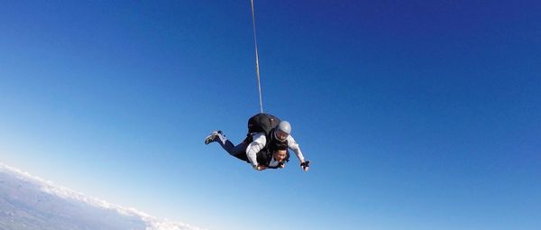 Low angle view of man against clear sky