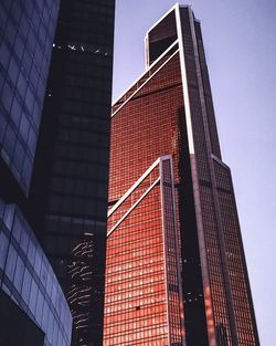 Low angle view of modern buildings against clear sky