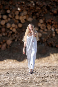 Woman with umbrella standing on ground