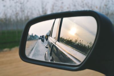 Reflection of car on side-view mirror