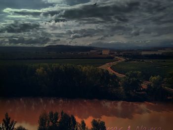 Scenic view of landscape against cloudy sky
