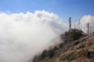 Panoramic view of smoke stack against sky
