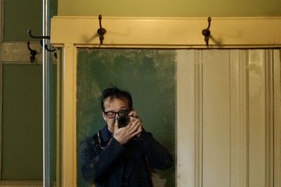 Portrait of man photographing