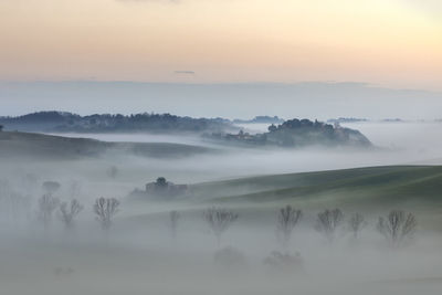 Scenic view of landscape against sky during sunset