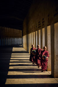 People in corridor of building