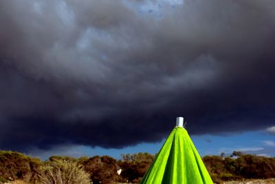 Scenic view of field against cloudy sky