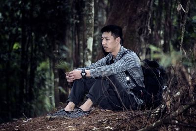 Portrait of young man in forest