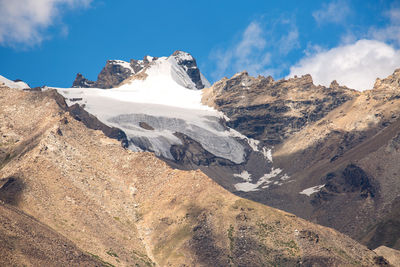 Panoramic view of snowcapped mountains against sky