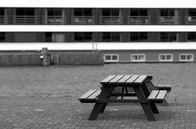 Empty chairs and tables in park