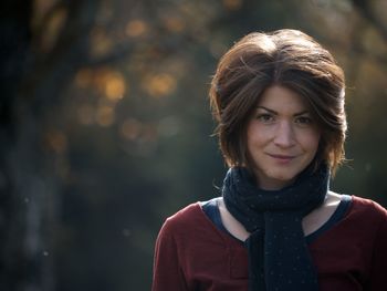 Portrait of smiling woman standing outdoors