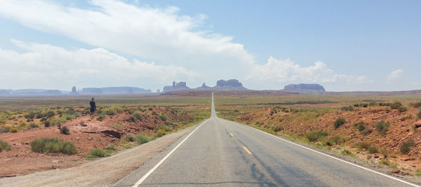 Road amidst landscape against sky