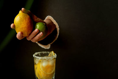 Close-up of lemon slice against black background