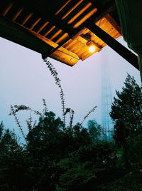 Low angle view of illuminated building against sky