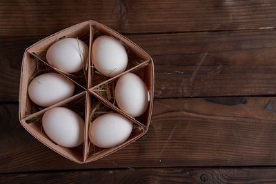 High angle view of eggs in box on table